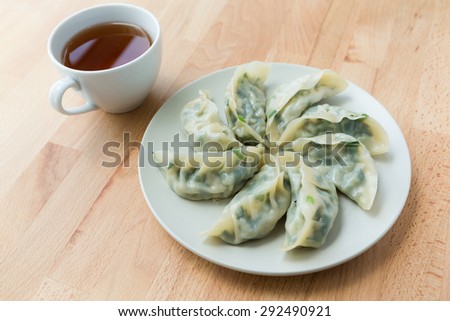 Chinese dumpling with a cup of tea