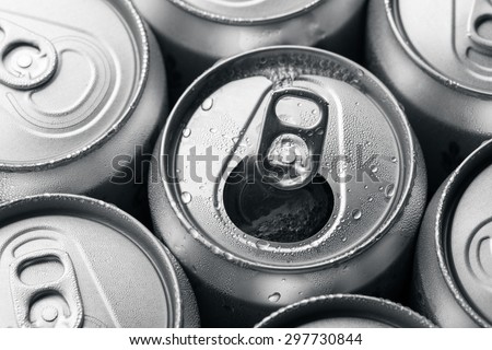Soda cans with one opened