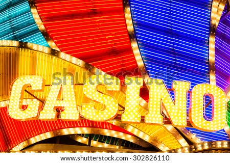 Neon casino sign lit up at night