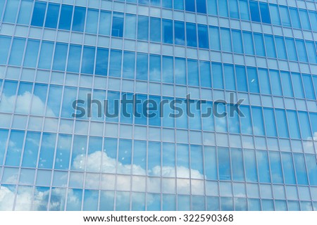 Blue clean glass wall of modern skyscraper