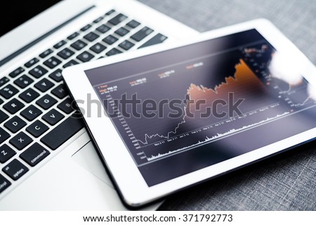 Stock market chart on digital tablet pc
