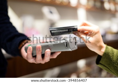 Customer paying credit card with NFC technology