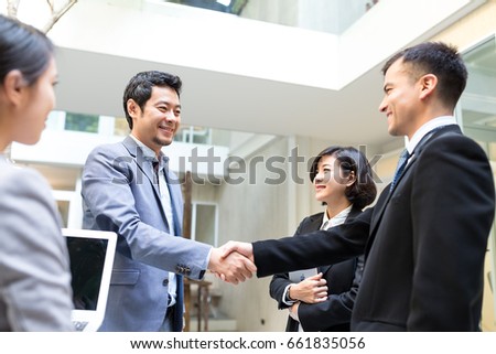 Business people make a deal