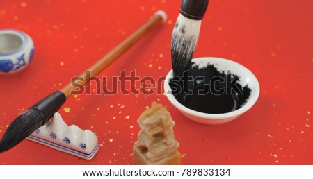 Dipping black ink for writing Chinese calligraphy