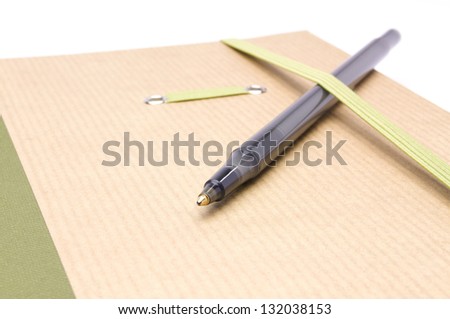 notebook with a pen for notes on a white background