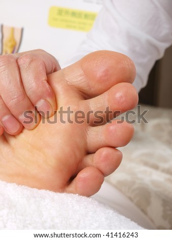Female hands giving zone therapy. Close up