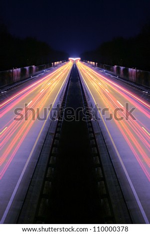 Long-exposure of cars rushing over a highway