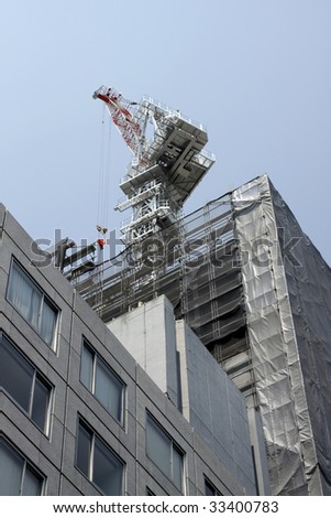 Crane on a skyscraper construction yard in Tokyo, Japan