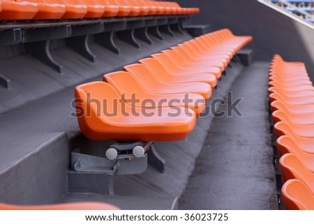 Group of empty seats in an olympic track and field stadium in Tokyo, Japan