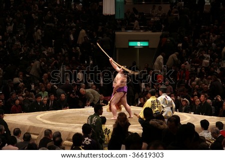 TOKYO - JANUARY 20: Sumo wrestler performs traditional bow dance in the Tokyo Grand Sumo Tournament January 20, 2009 in Tokyo, Japan.