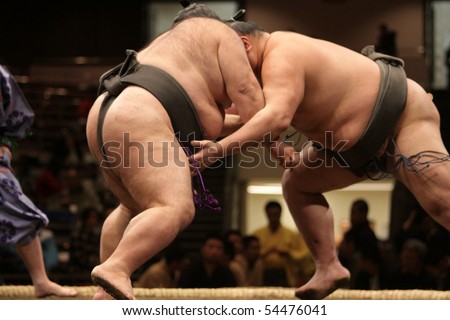 stock-photo-tokyo-february-close-up-of-two-sumo-wrestlers-in-a-tight-grip-during-the-tokyo-grand-sumo-54476041.jpg