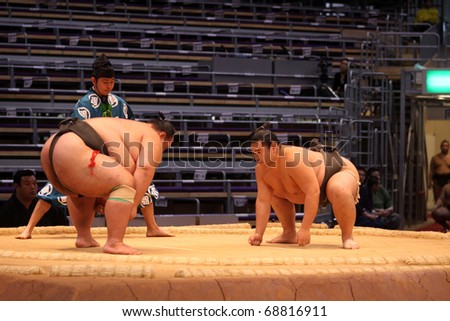 FUKUOKA, JAPAN - NOVEMBER 19: Small and big sumo wrestlers ready to engage in the arena of the Fukuoka Tournament on November 19, 2010 in Fukuoka, Japan.
