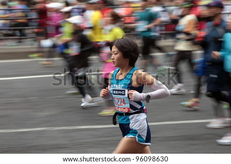 TOKYO - FEBRUARY 26: Unidentified runners participating in Tokyo Marathon on February 26, 2012 in Tokyo, Japan. With more than 36,000 athletes annually, the event is one of the biggest in Japan.