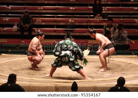 TOKYO - JANUARY 14: Unidentified wrestlers in the Grand Sumo Tournament in Tokyo, Japan on January 14, 2012. Although baseball has surpassed sumo in viewers, it is still Japan's national sport