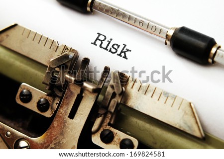 Risk text on typewriter
