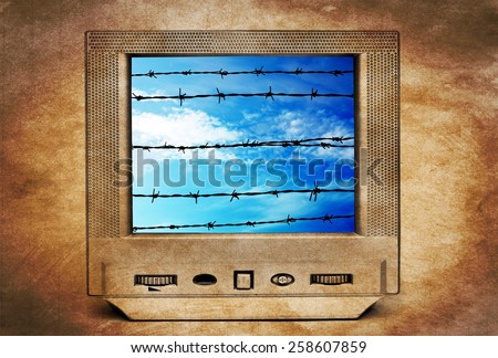 Old TV and barbwire concept