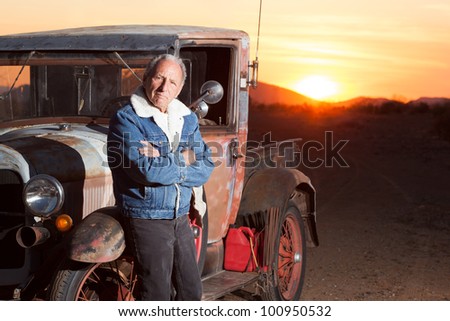 Portrait of Senior Man Next to His Vintage Truck