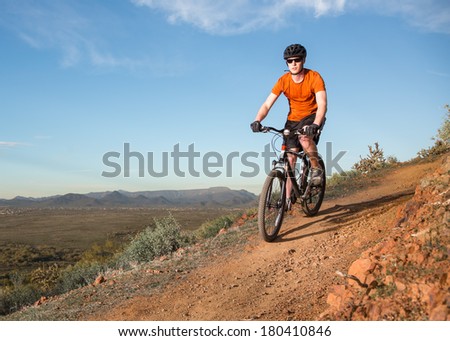 Biker on Desert Trail