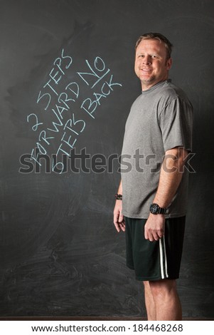 Portrait of Man, in Successful Weight Loss Program, Standing Next to Motivational Quote.