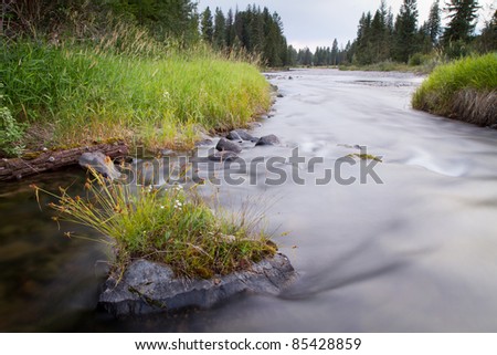 Smooth Water Effect as River Flows Around Rock (Blackfoot River, Montana)