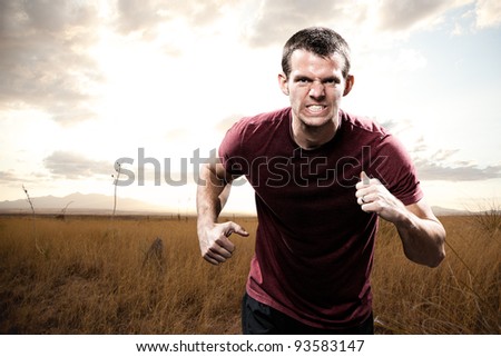 Man Running with Intensity and Determination