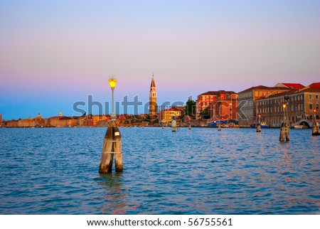 Sanset in Venice. Lanterns, reflection, sea, color, bright, tourism, travel, Europe, Italy, night, purple, orange, blue,
