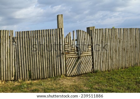 Old wood picket fence and gate with latch