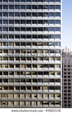 A highly repetitive downtown office building facade represents the nature of modern life