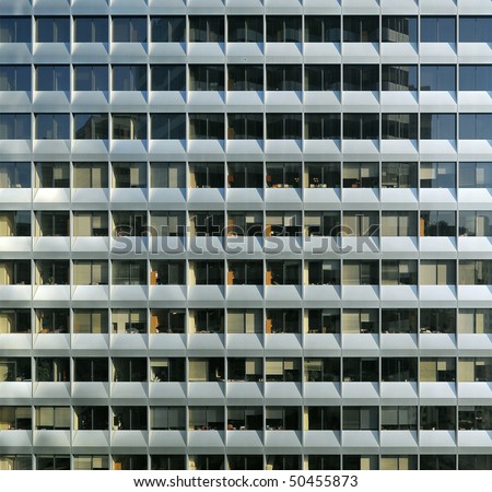 The repetitive facade of a office building represents the character of modern life