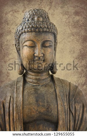 Antique wood carving of Buddha, very shallow depth of field with focus on eyes; placed on sepia marbled background.