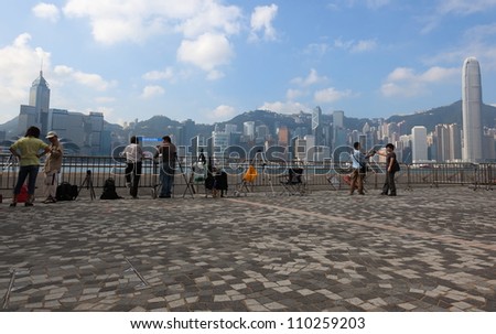 HONG KONG  - OCTOBER 01: National Day of the People\'s Republic of China on October 01, 2010 in Hong Kong. From early morning photographers reserve their spots for the night fireworks.