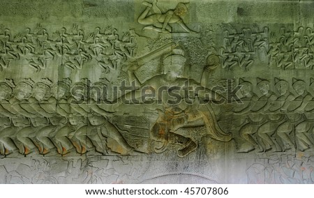 Bas relief \'Churning of the ocean of milk\'. In Hinduism, Samudra manthan (Devanagari) or The churning of the ocean of milk is one of the most famous episodes. Angkor Wat. Cambodia