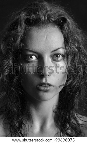 black and white portrait of a girl a woman with big eyes and curly hair