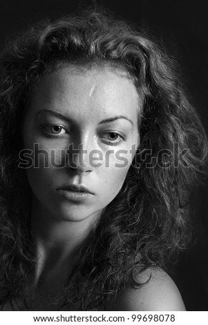 black and white portrait of a girl a woman with big eyes and curly hair