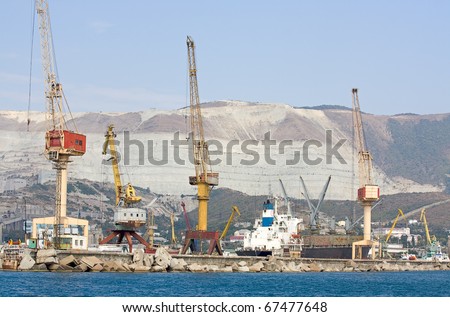 Tower cranes to load cargo ships in  port of Novorossiysk, Russia.