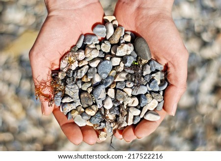 Handful of stones in hands