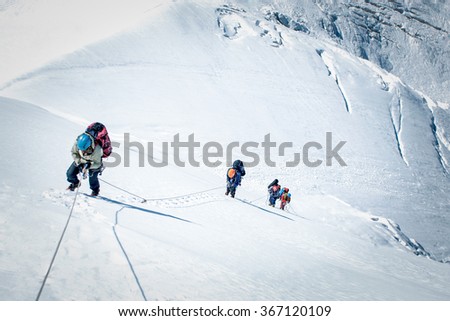 A group of climbers reaching the summit