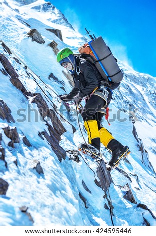 A climber reaching the summit of the mountain Everest