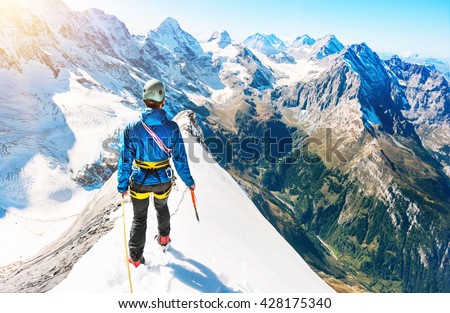 Young climber reaching the summit, Nepal Himalayas