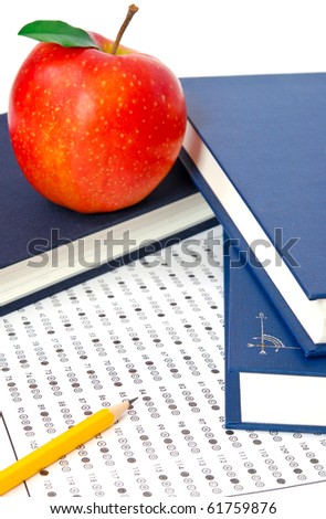 Test score sheet with answers, book and apples