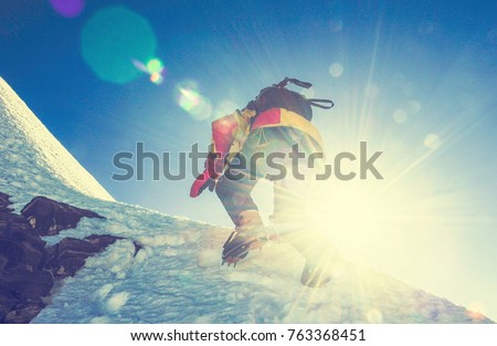 Group of climbers reaches the top of mountain peak. Climbing and mountaineering sport. Nepal mountains.