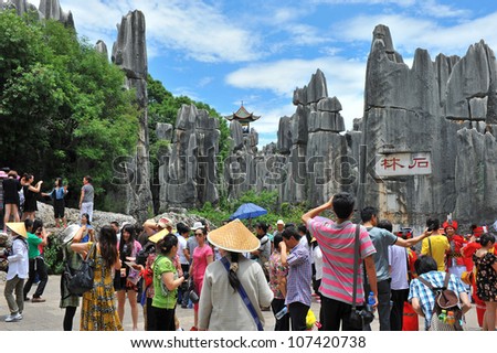KUNMING - OCT 1: crowd of people travel during national holiday on October 1, 2011 in Kunming, China. More than 20.000 people visit sites like the Kunming Stone Forest daily.
