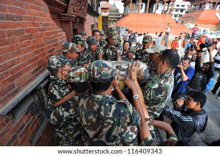 KATHMANDU- SEP 29: Nepalese army help making preparations during Indra Jatra on September 29, 2012 in Kathmandu,Nepal. Indra Jatra is an important festival of Nepal celebrating the end of the monsoon.