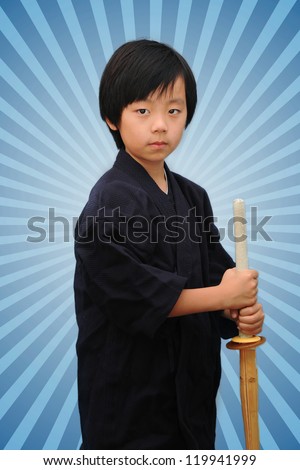 Young Asian boy practicing kendo ( Asian form of martial arts )