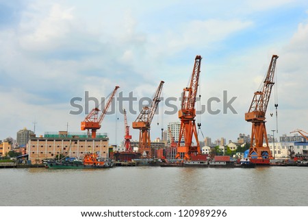 SHANGHAI - APRIL 5: Docks at Shanghai harbor on April 5, 2012 in Shanghai, China. From 2010, Shanghai became the world\'s busiest container port, handling over 30 million TEUs - a historic record.