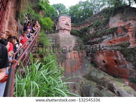 LESHAN - OCT 7: Tourists visit world's largest Buddha during Chinese National holiday on October 7, 2012 in Leshan, China. During this holiday around 740 million trips will be made by Chinese people.