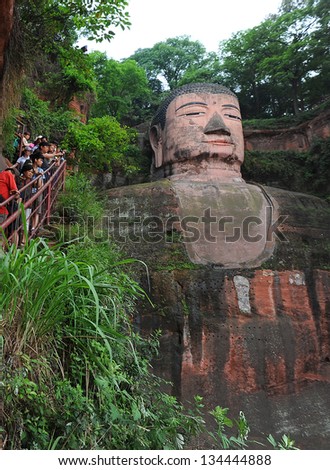 LESHAN - OCT 7: tourists visit world\'s largest Buddha during Chinese National holiday on October 7, 2012 in Leshan, China. During this holiday around 740 million trips will be made by Chinese people.
