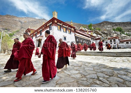 LHASA - MAY 1: monks leave the main assembly hall of  Sera monastery on May 1, 2013 in Lhasa. The main assembly hall is the venue for religious chanting - part of the religious curriculum.