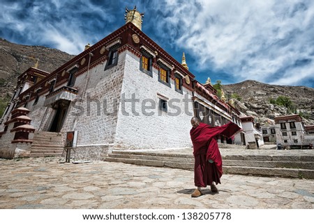 LHASA - MAY 1: unidentified monk leaves the main assembly hall of Sera monastery on May 1, 2013 in Lhasa. The main assembly hall is the venue for religious chanting - part of the religious curriculum.
