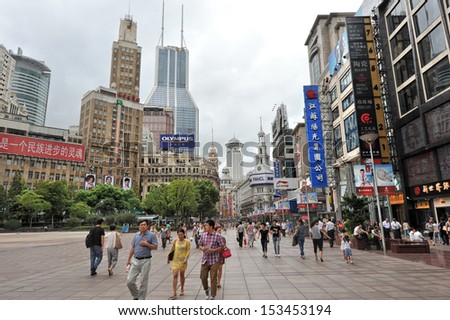 SHANGHAI - MAY 2: Chinese tourist sites attract huge crowds of people during May Holiday on May 2, 2013 in Shanghai, China. Here at Nanjing Lu commercial tourist street.
